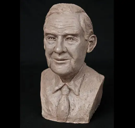 A detailed bust sculpture of a middle-aged man with a calm expression.