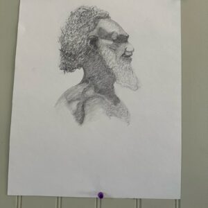 Detailed pencil sketch of a bearded man in profile.
