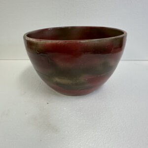 Handcrafted ceramic bowl with earthy tones.