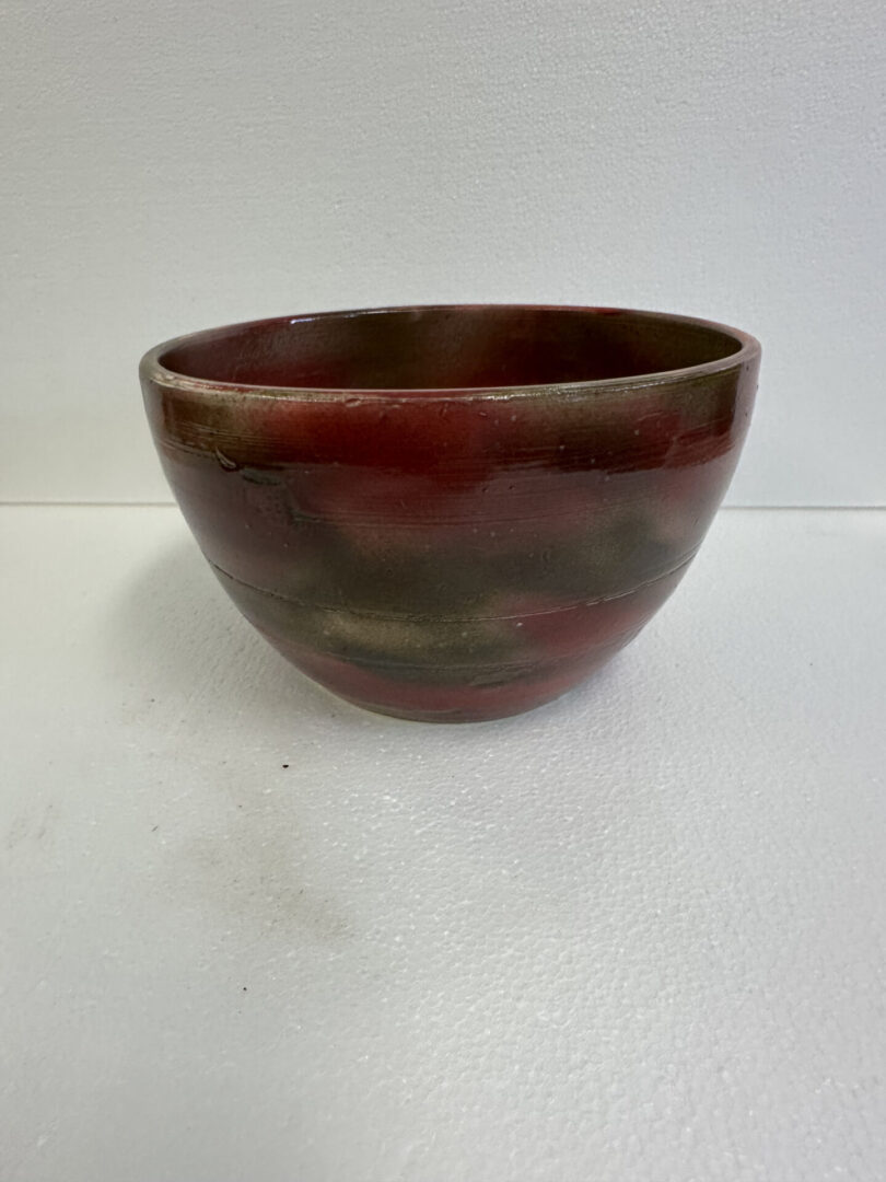 Handcrafted ceramic bowl with earthy tones.