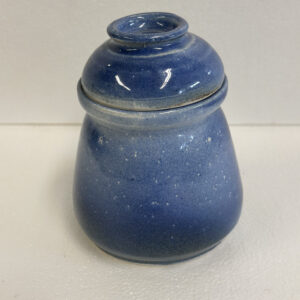 Small blue ceramic jar with a rounded lid.