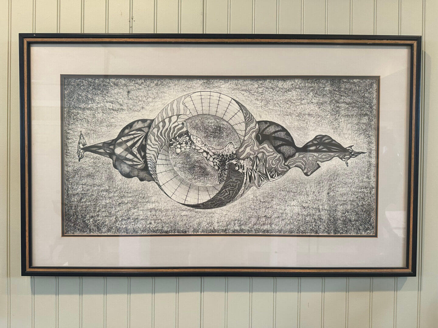 Intricate black and white abstract artwork with circular and organic shapes.